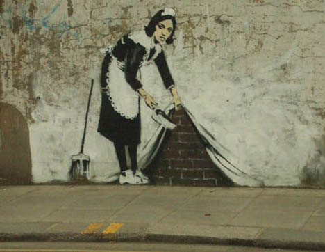 guerrilla art banksy maid sweep