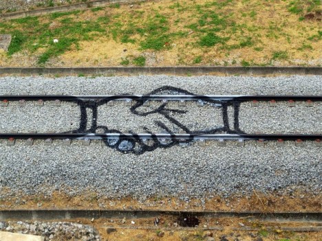 train painting hand shake